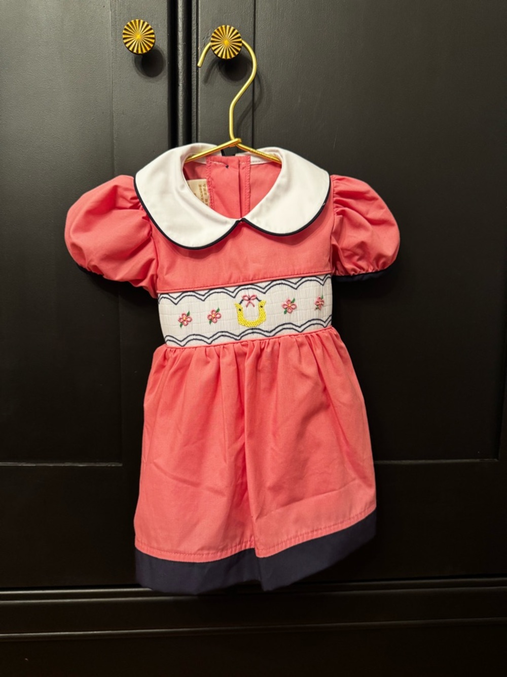 Girls Pink Smocked Dress with White Peter Pan Collar with horseshoe